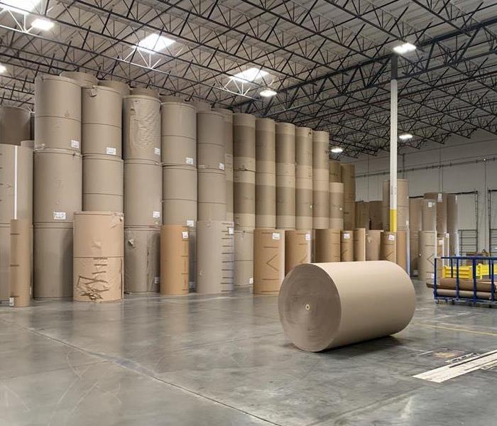 warehouse with large paper rolls on a clean floor